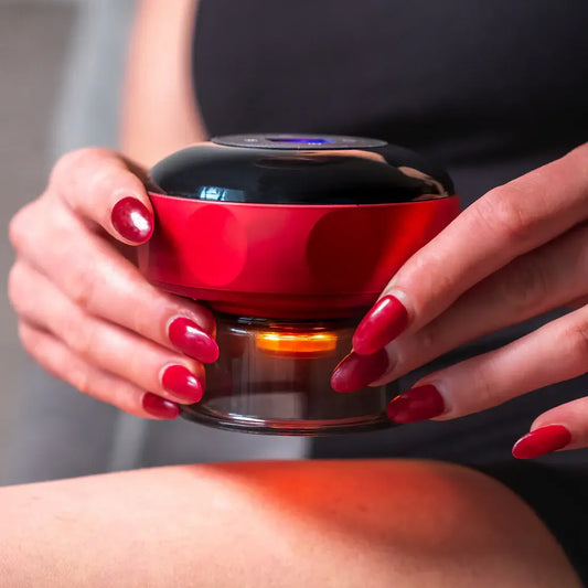 Person using the ELVORAPRO Smart Cupping Massager™ on their leg for relaxation.